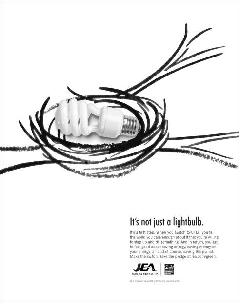 Bird nest holding a CFL lightbulb.